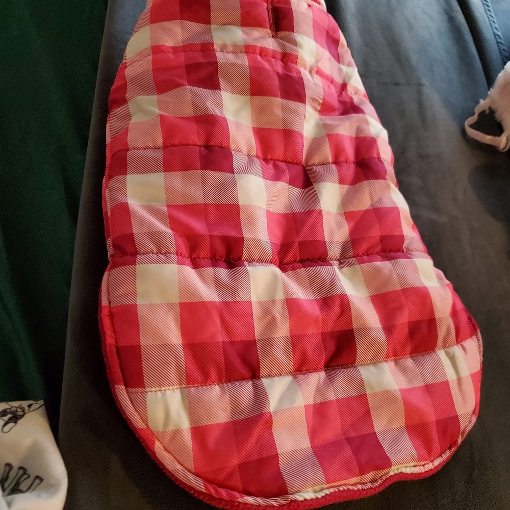 Dog jacket 20 inches long adjustable velcro for size. Sized for small to medium